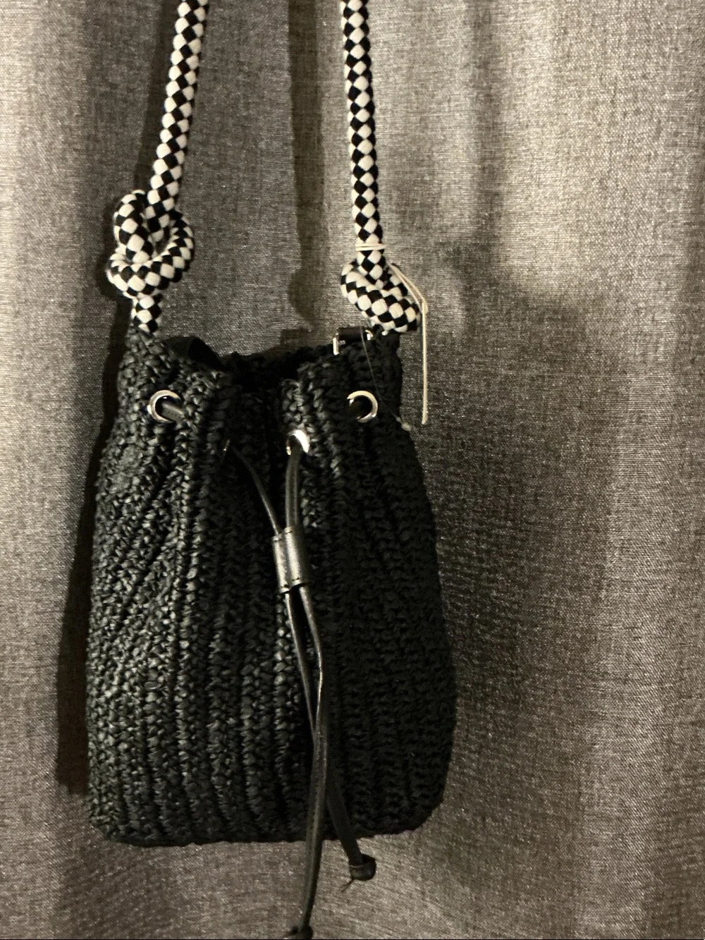 Black Woven Drawstring Crossbody Bag with Patterned Strap